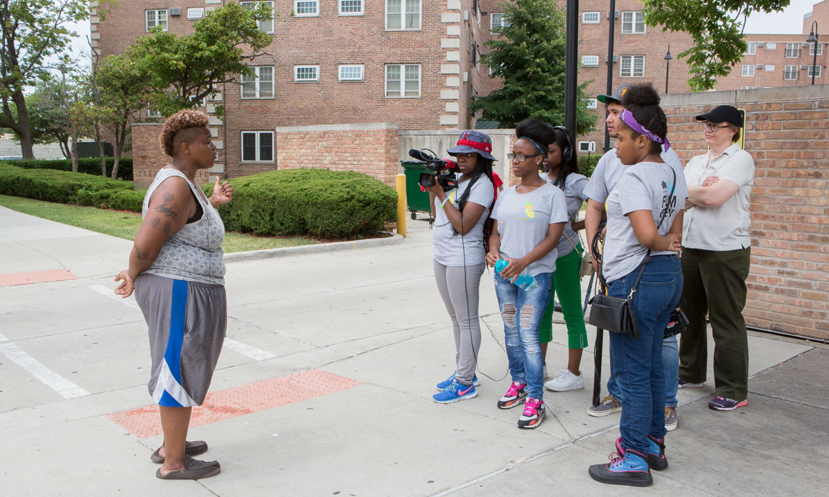 student film crew interviewing a young adult