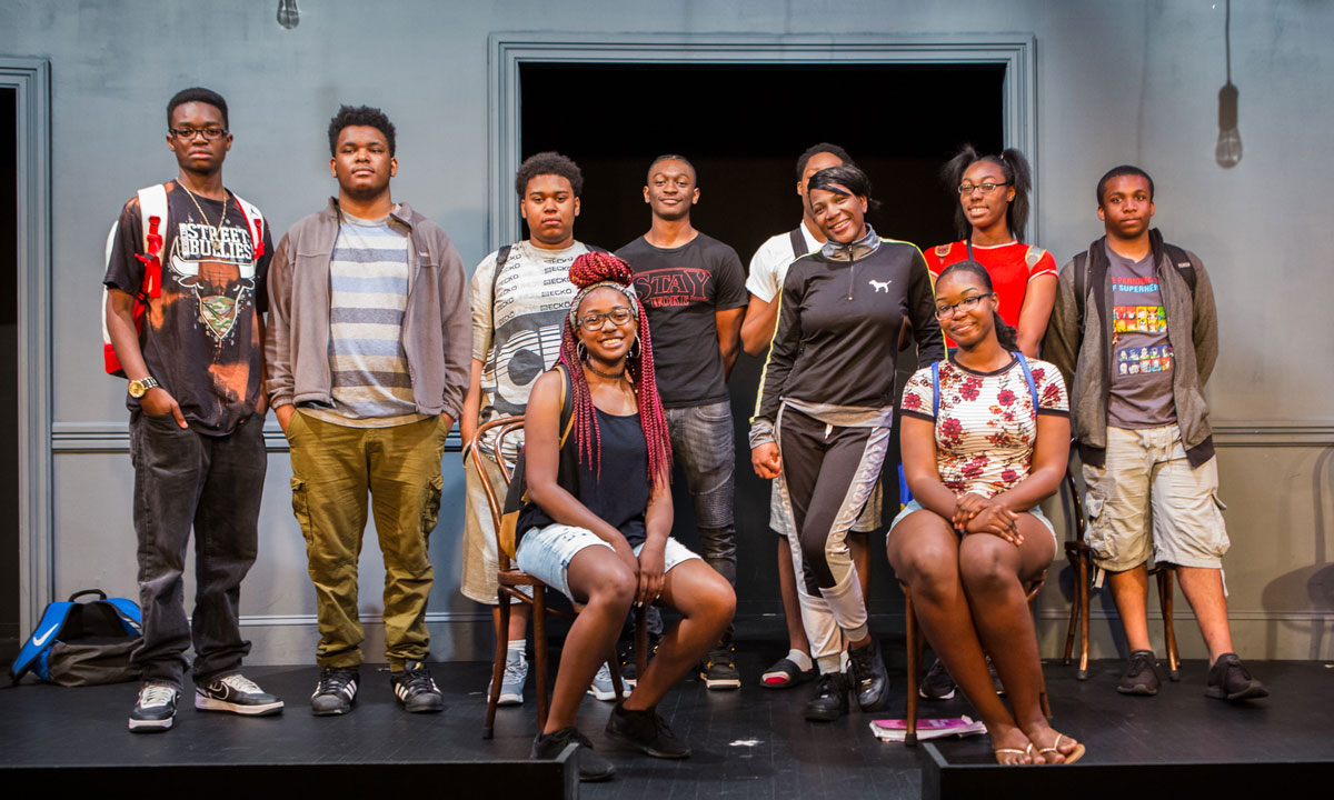 Instructor with student using a computer